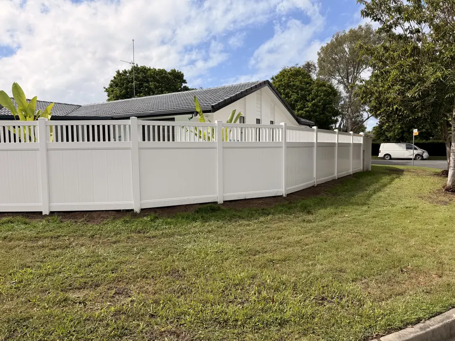 PVC lattice-top fence following the contour of a sloping front boundary